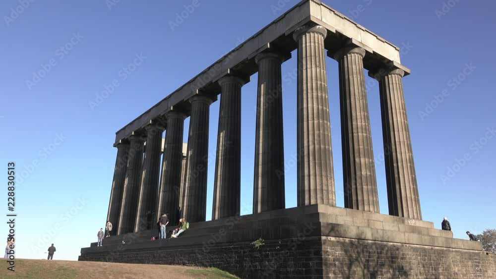 Calton Hill on a bright Autumn day. Tourists on the National Monument. Calton Hill on a bright Autumn day. Tourists on the National Monument.
