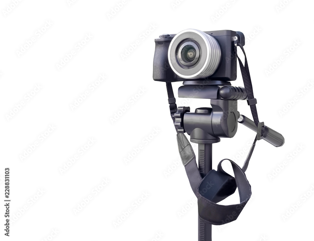 Digital camera on the tripod isolated over white Digital camera on the tripod isolated over white