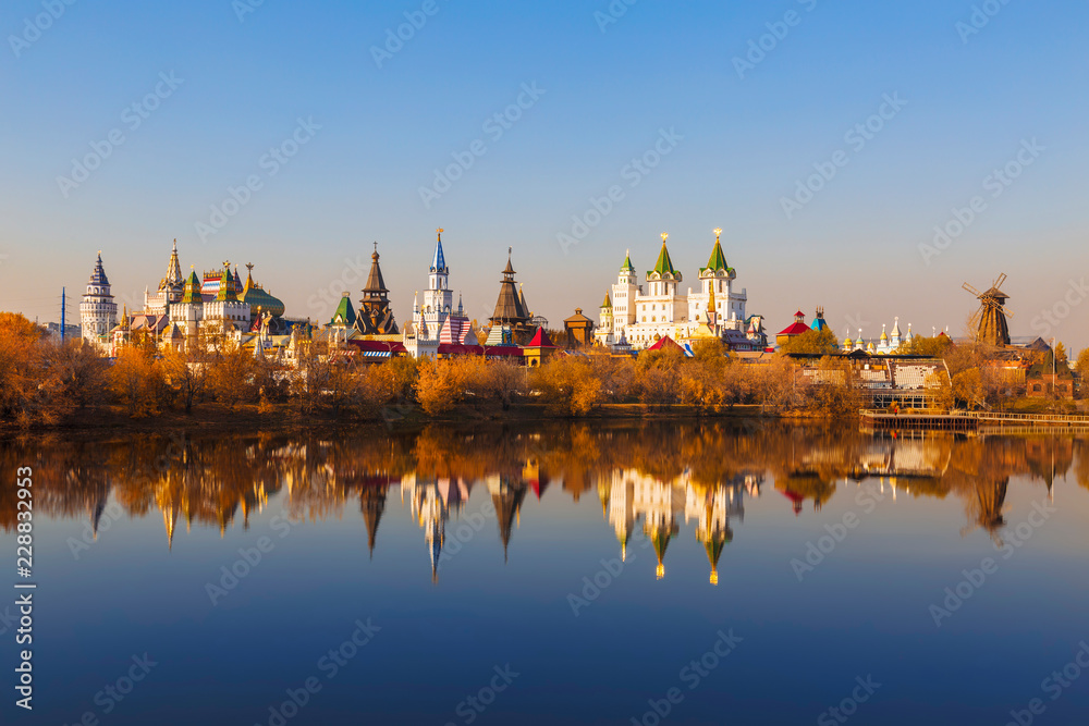 View of the Izmailovo kremlin and the silver-Grape pond in the golden autumn. Moscow, Russia View of the Izmailovo kremlin and the silver-Grape pond in the golden autumn. Moscow, Russia
