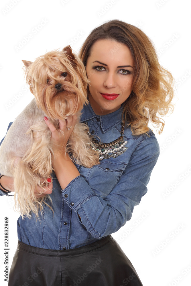 young positive woman with yorkshire terrier dog