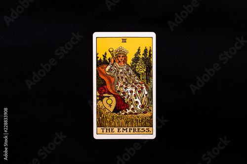 An individual major arcana tarot card isolated on black background. The Empress. photo