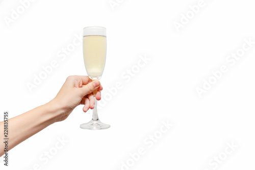 Femal hand holding champagne glass. Holiday Concept. White background, isolated, close up