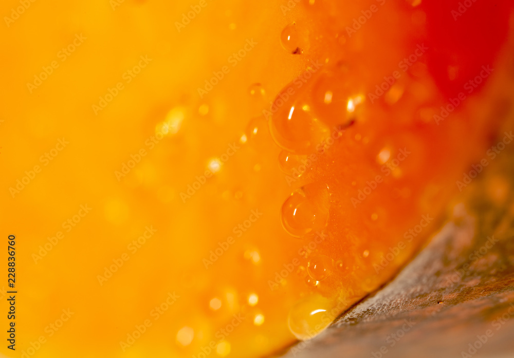 Drops of juice on pumpkin pulp as abstract background Drops of juice on pumpkin pulp as abstract background