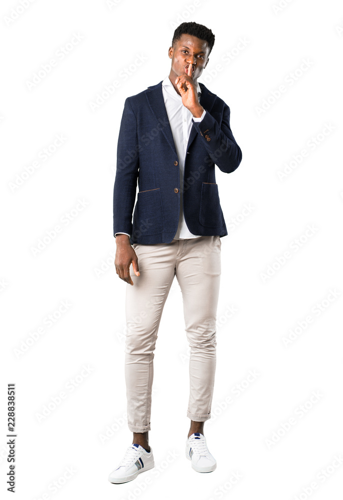 Full body of Handsome african american man wearing a jacket showing a sign of closing mouth and silence gesture on white background Full body of Handsome african american man wearing a jacket showing a sign of closing mouth and silence gesture on white background
