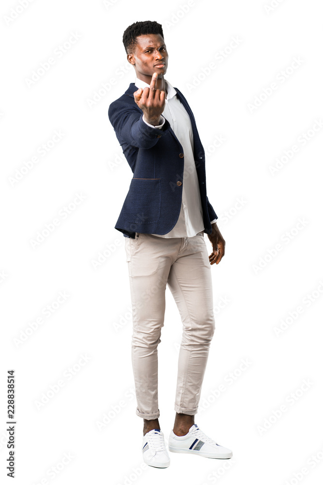 Full body of Handsome african american man wearing a jacket making horn gesture. Negative expression on white background Full body of Handsome african american man wearing a jacket making horn gesture. Negative expression on white background