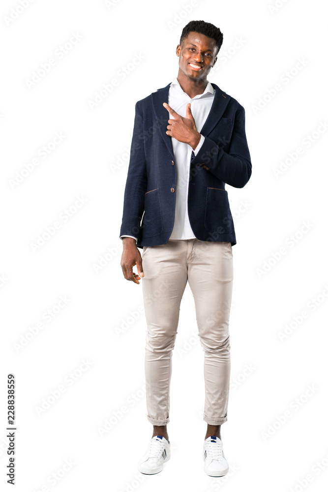 Full body of Handsome african american man wearing a jacket pointing to the side with a finger to present a product or an idea while looking forward smiling on white background Full body of Handsome african american man wearing a jacket pointing to the side with a finger to present a product or an idea while looking forward smiling on white background
