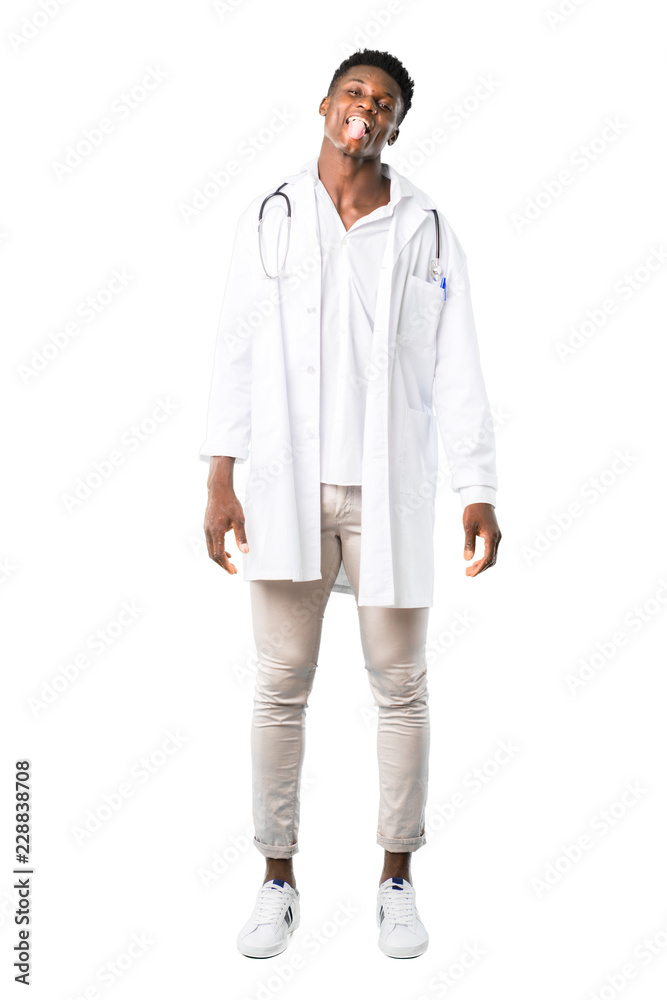 Full body of African american doctor showing tongue at the camera having funny look on white background Full body of African american doctor showing tongue at the camera having funny look on white background