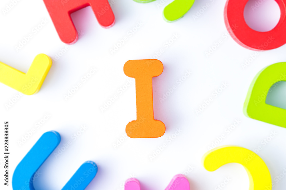 Naklejka premium I letters in English made from wood bright colors.