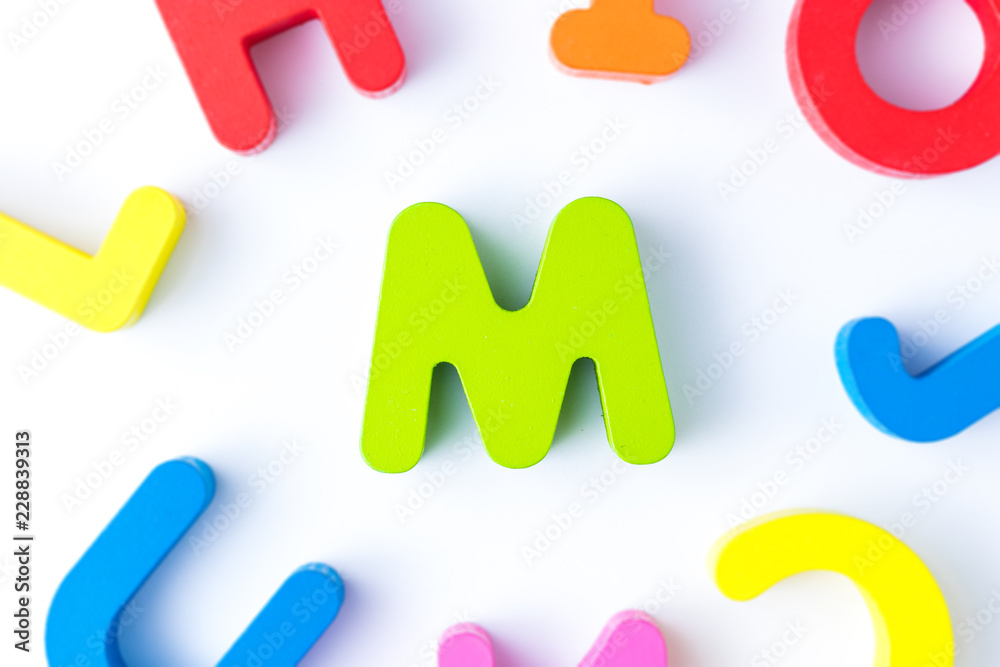M letters in English made from wood bright colors. M letters in English made from wood bright colors.