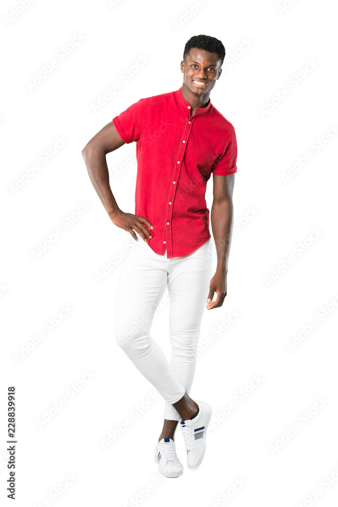 Full body of Young african american man posing with arms at hip and smiling on white background Full body of Young african american man posing with arms at hip and smiling on white background