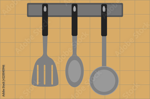Espátula, cuchara, y cucharón de cocina.