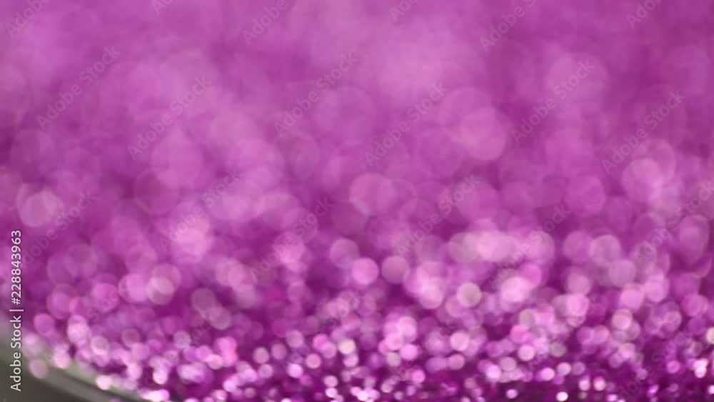 Blurry background of purple glitter sparkles, video,motion Blurry background of purple glitter sparkles, video,motion