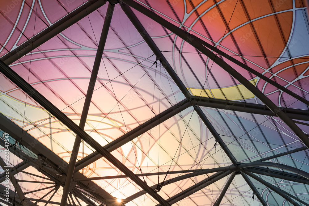 Colorful patterns on a glass roof of tram stop in Łódź, Poland.