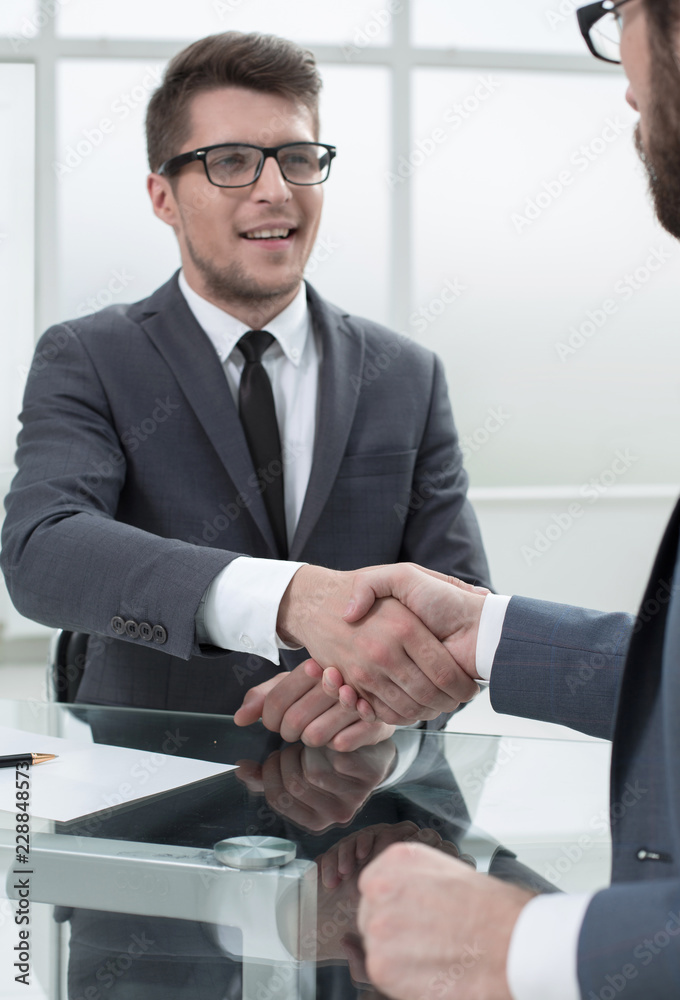 close up.businessman shaking hands with his partner close up.businessman shaking hands with his partner