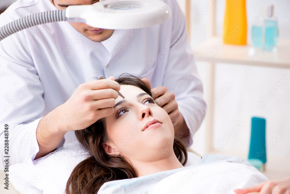 Woman visiting doctor cosmetologyst in beauty concept Woman visiting doctor cosmetologyst in beauty concept