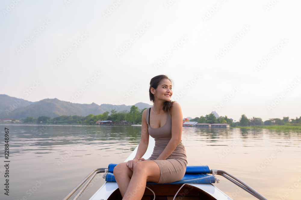 Young beautiful Asian tourist woman traveling with boat in Thailand