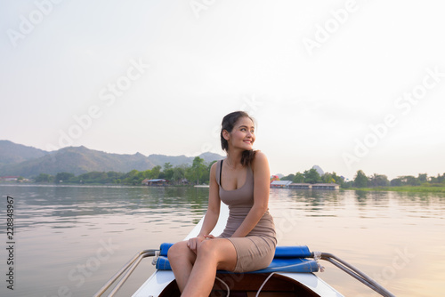 Young beautiful Asian tourist woman traveling with boat in Thailand © Ranta Images
