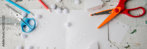 Banner Creative paper Christmas tree on white paper sheet, scissors and colorful crayons on color table background