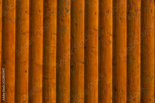 wall of wooden lacquered vertical boards background