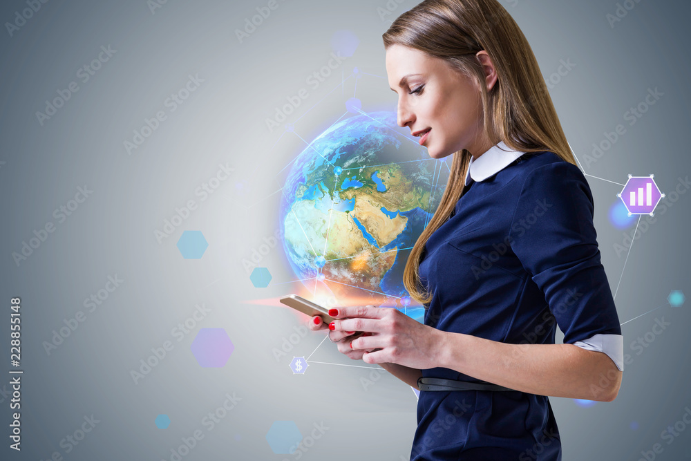 Businesswoman with phone, hi tech earth Businesswoman with phone, hi tech earth
