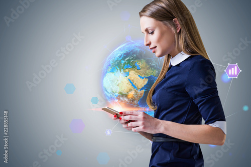 Businesswoman with phone, hi tech earth