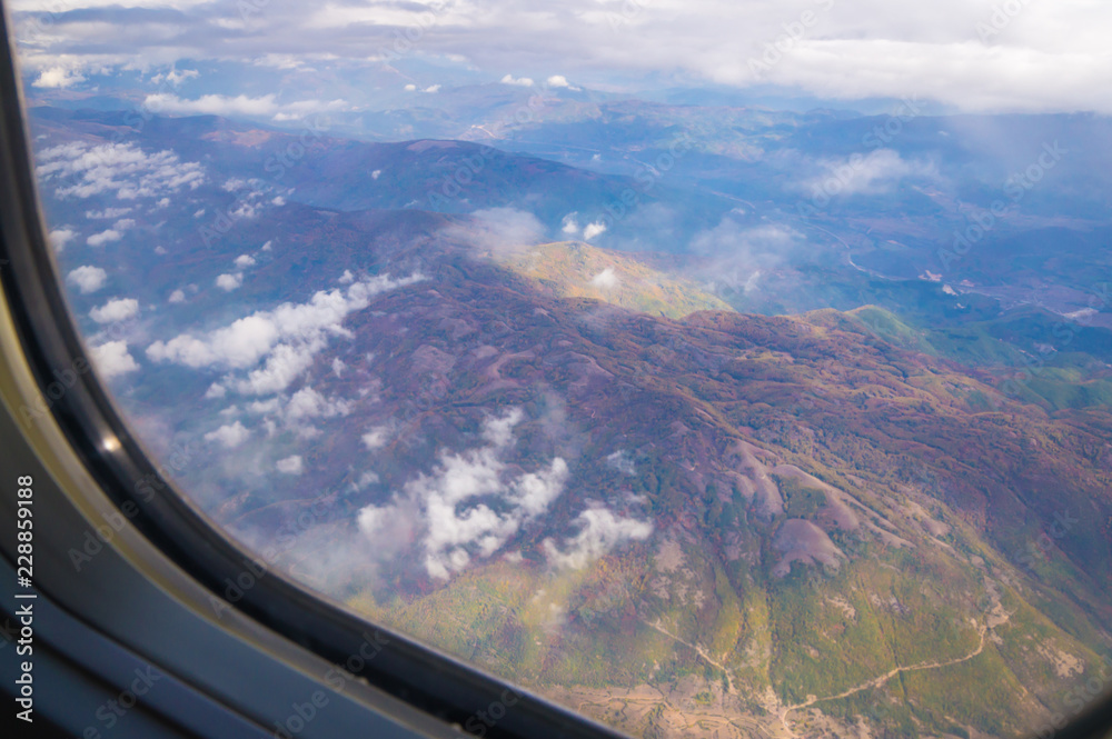 Cloudy mountain view from airplane window, Macedonia. Cloudy mountain view from airplane window, Macedonia.