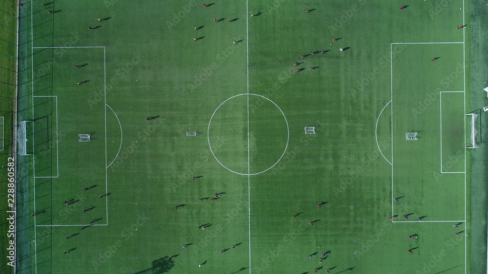 Aerial view of a soccer , football match. Football field and Footballers Aerial view of a soccer , football match. Football field and Footballers