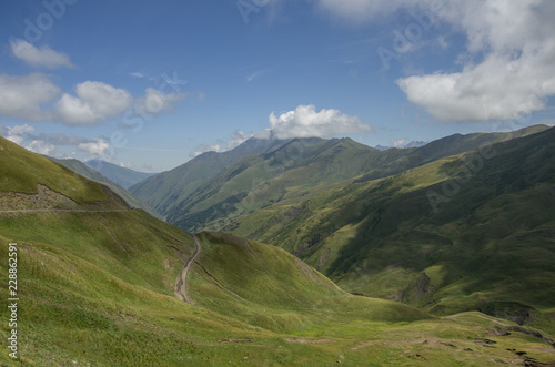 Serpentine road. Panorama of mountain valley from top of Datvisjvari Pass, Georgia, Europe