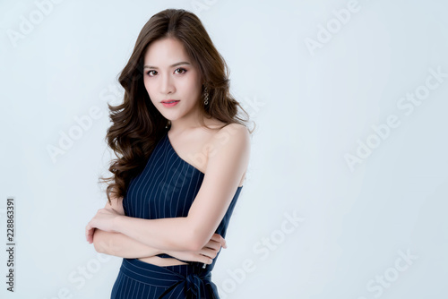 beautiful attractive elegance asian woman in blue dress hand touch face model pose on studio photo shoot isolate white background
