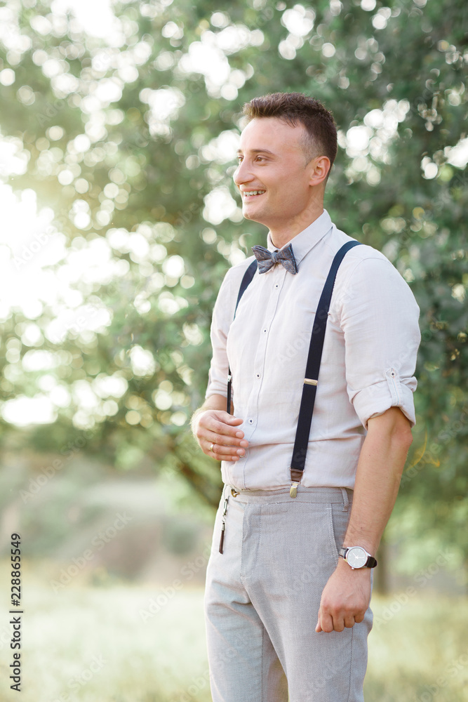 Portrait of a young handsome groom outdoors. Portrait of a young handsome groom outdoors.