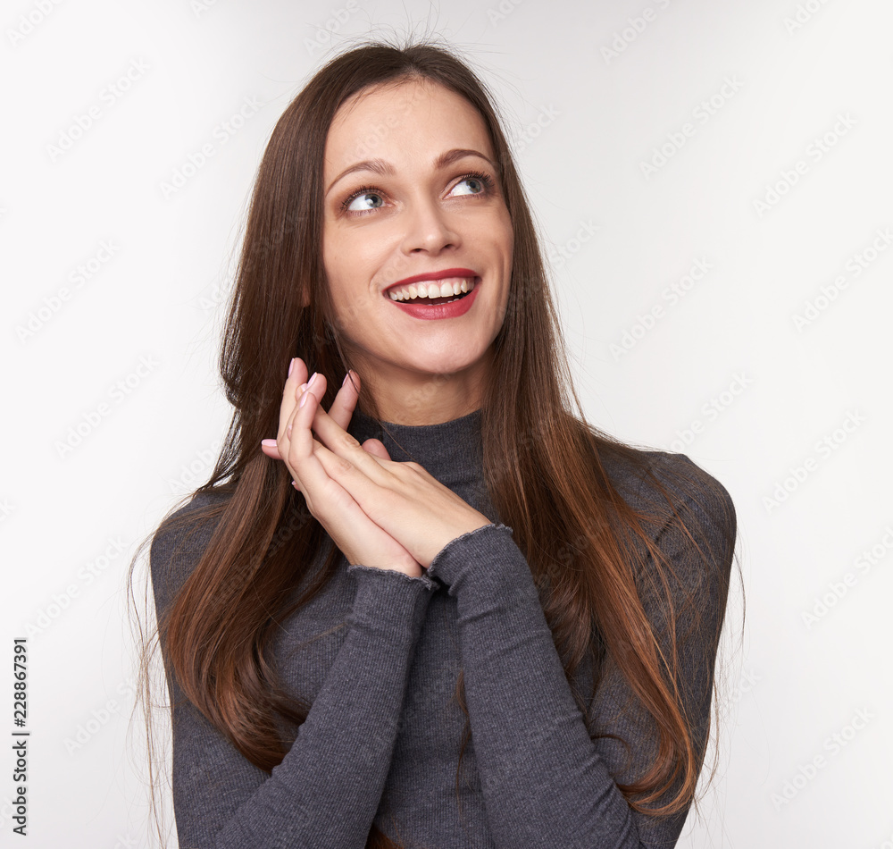 Cheerful woman smiling and looking up. Isolated Cheerful woman smiling and looking up. Isolated