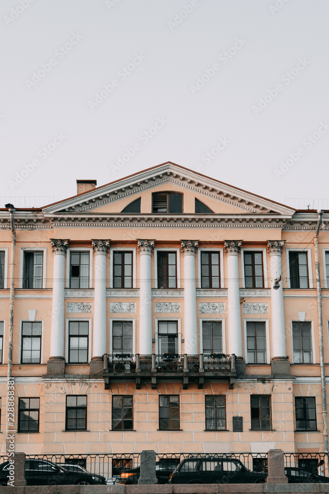 Fototapeta premium Elements of architecture of historical buildings. The streets of St. Petersburg with its bridges and rivers. Night view of the city at sunset.