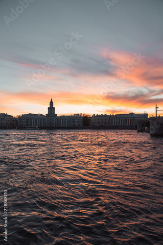 Elements of architecture of historical buildings. The streets of St. Petersburg with its bridges and rivers. Night view of the city at sunset.