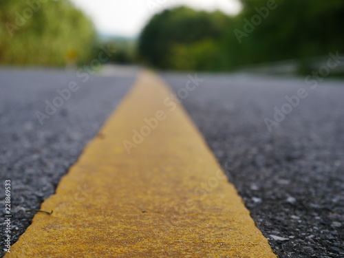 asphalt road with red lines