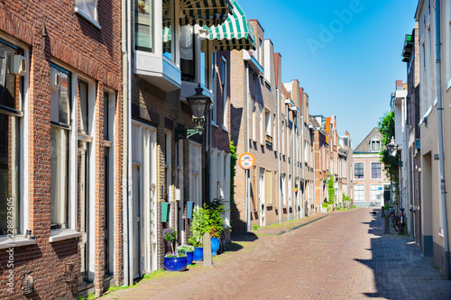 small pedestrian paved street in Leiden historical old town, Netherlands photo