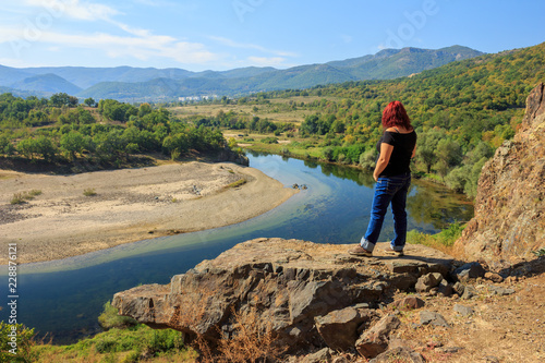 Tourist watching beautiful landscape of crystal river and mountains