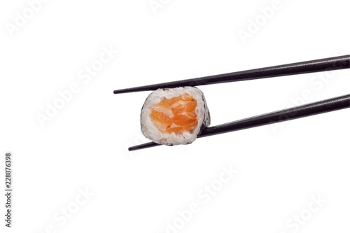 japanese salmon maki sushi roll with chopsticks isolated on white background with clipping path