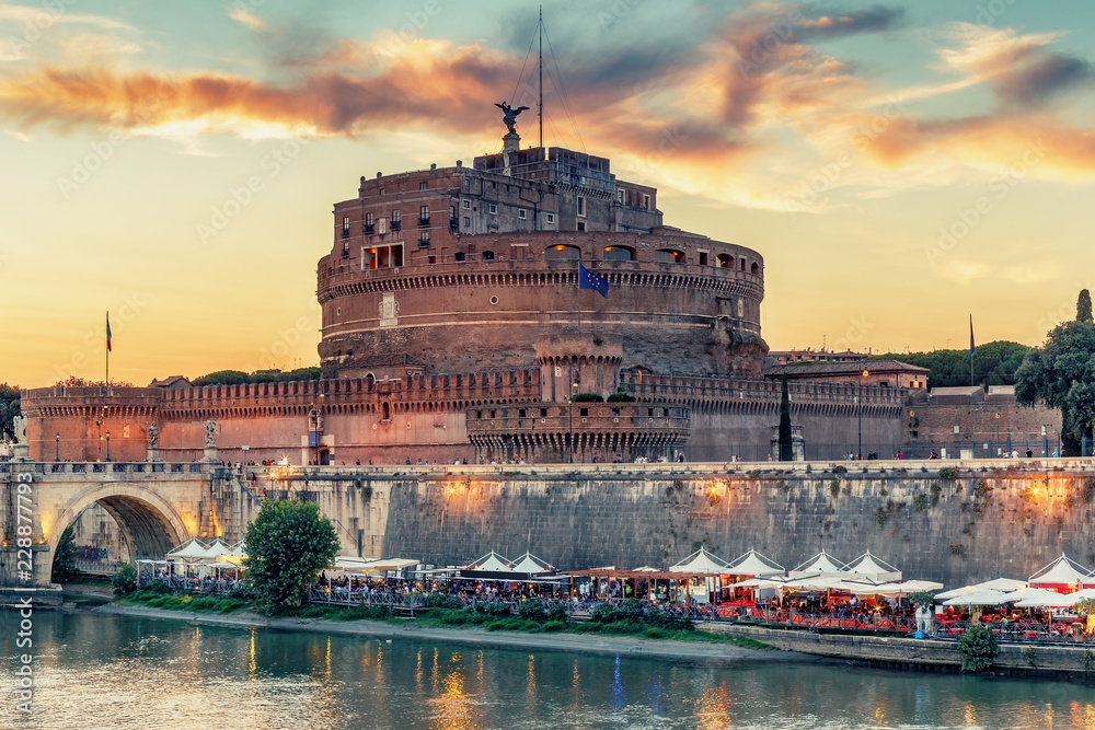 Fototapeta premium View on Castel St. Angelo in Rome, Italy, at sunset. Scenic travel background.