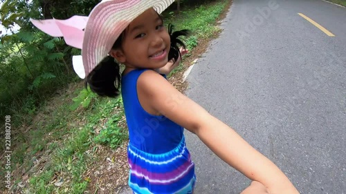 Happy asian child leads the father's hand. Family travel and love concept.