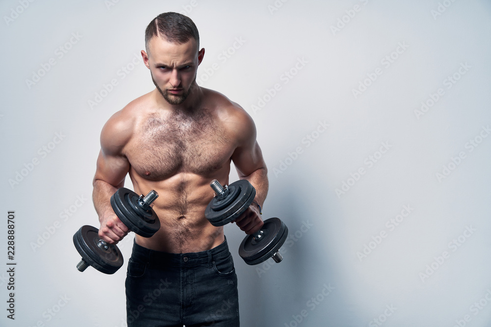 Strong handsome shirtless sport man making weightlifting