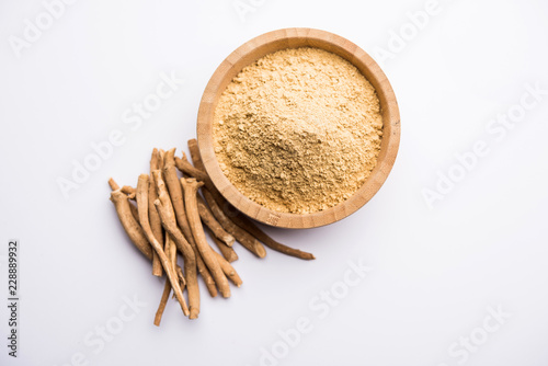 Ashwagandha / Aswaganda OR Indian Ginseng is an Ayurveda medicine in stem and powder form. Isolated on plain background. selective focus