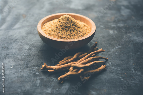 Ashwagandha / Aswaganda OR Indian Ginseng is an Ayurveda medicine in stem and powder form. Isolated on plain background. selective focus