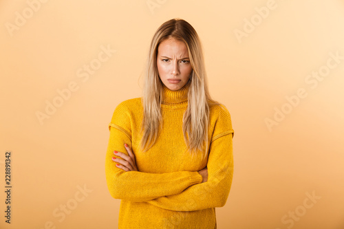 Portrait of an upset young woman dressed in sweater