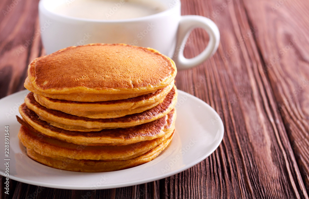 Stack of pumpkin pancakes on plate Stack of pumpkin pancakes on plate