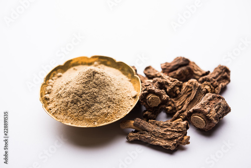 Hemidesmus indicus also known as Ananthamoola or Naruneendi or Nannari in dried steam and powder form. It's a useful Ayurvedic medicine from India photo