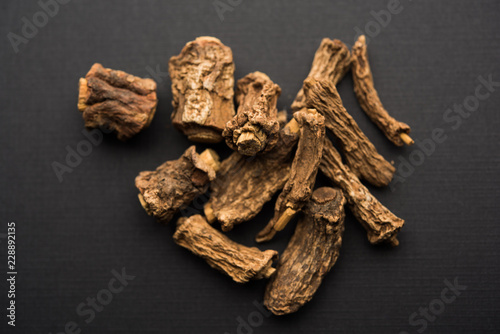 Hemidesmus indicus also known as Ananthamoola or Naruneendi or Nannari in dried steam and powder form. It's a useful Ayurvedic medicine from India photo