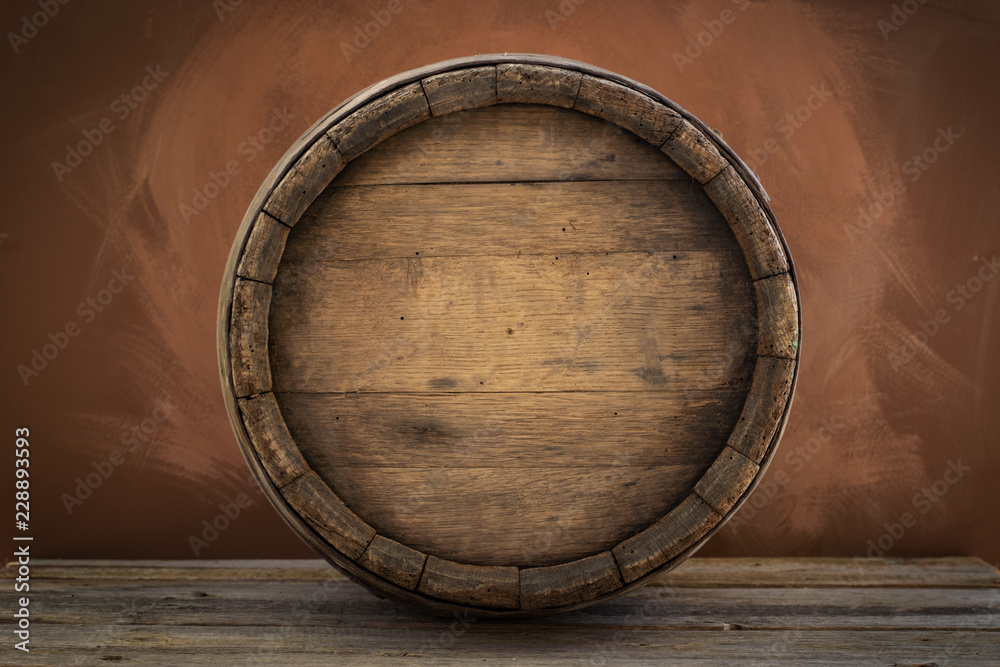 Fototapeta premium background of barrel and worn old table of wood