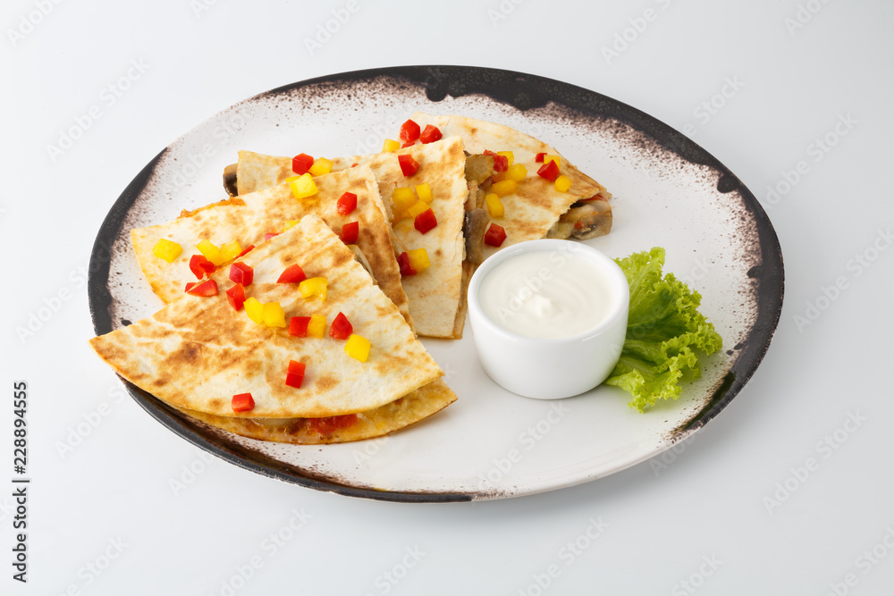 pita bread with filling on a white plate isolated on white background