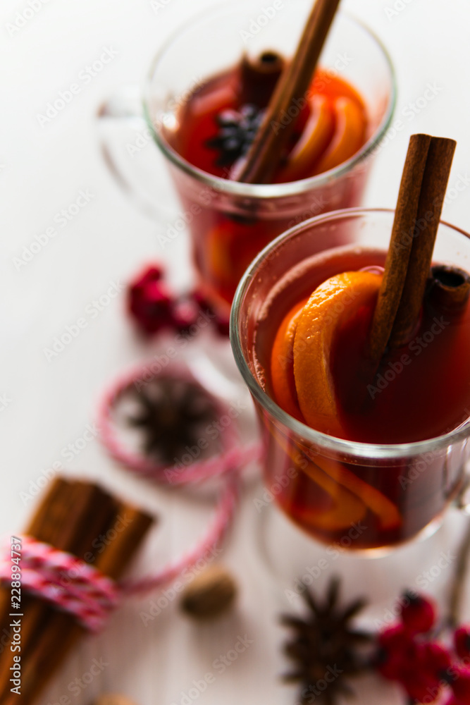 Two glass of mulled wine on the white wooden table