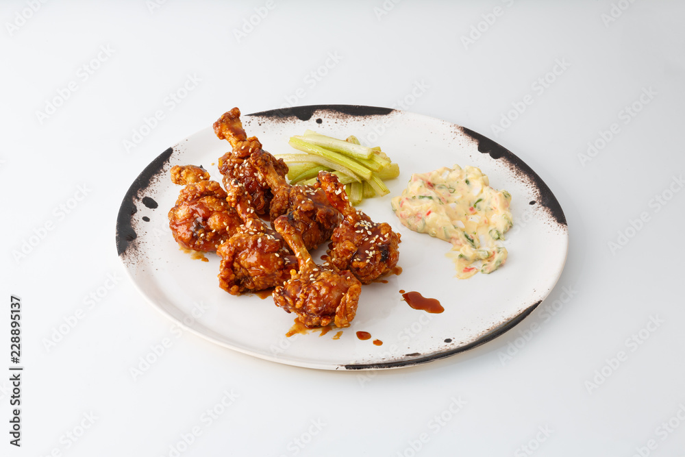 fried chicken legs with salad isolated on white background fried chicken legs with salad isolated on white background